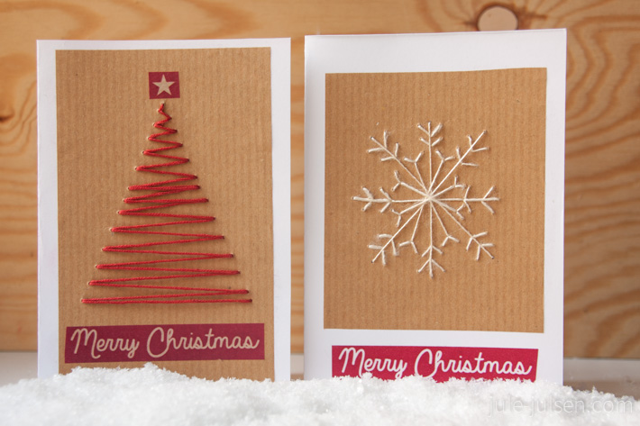 zwei Weihnachtskarten mit Tannenbaum- und Schneeflockenmotiv aus Naehgarn gemacht