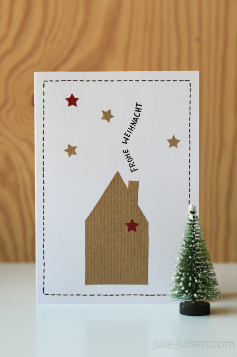 Weihnachtskarte mit Haus und Sternenhimmel aus Papier