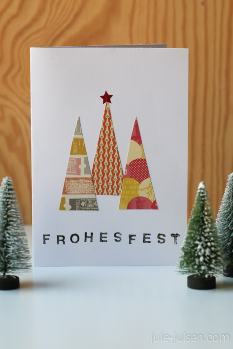 Weihnachtskarte mit drei Tannenbaeumen aus buntem Papier